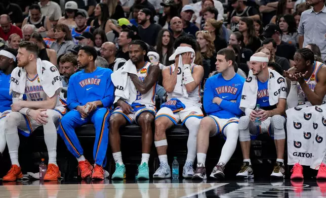 The Oklahoma City Thunder bench watches play against the San Antonio Spurs in the second half of Game 6 in the Western Conference finals NBA basketball playoffs series, Thursday, May 28, 2026, in San Antonio. (AP Photo/David J. Phillip)