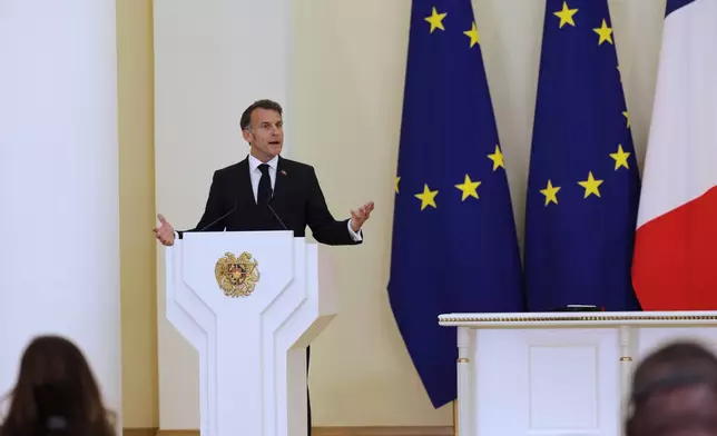 French President Emmanuel Macron addresses a media conference during the EU-Armenia summit at the Presidential Palace in Yerevan, Armenia, Tuesday, May 5, 2026. (AP Photo/Anthony Pizzoferrato)