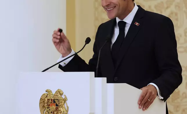 French President Emmanuel Macron addresses a media conference during the EU-Armenia summit at the Presidential Palace in Yerevan, Armenia, Tuesday, May 5, 2026. (AP Photo/Anthony Pizzoferrato)