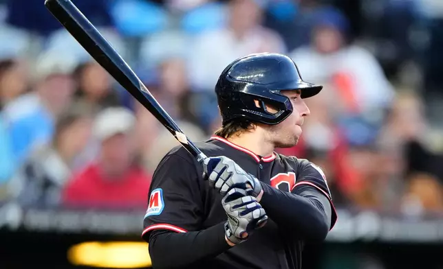Cleveland Guardians' Chase DeLauter watches his two-run single during the fifth inning of a baseball game against the Kansas City Royals, Wednesday, May 6, 2026, in Kansas City, Mo. (AP Photo/Charlie Riedel)