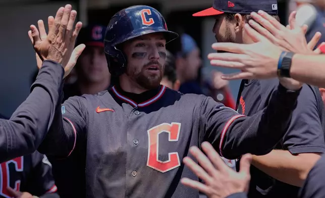 Cleveland Guardians' Daniel Schneemann celebrates after scoring against the Detroit Tigers during the third inning of a baseball game Thursday, May 21, 2026, in Detroit. (AP Photo/Paul Sancya)