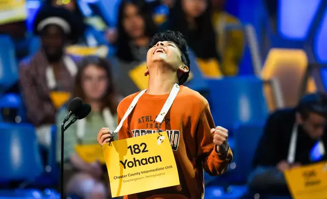 Yohaan Damani, 13, of Downingtown, Pa., celebrates after providing a correct answer during the first preliminary round of the Scripps National Spelling Bee, Tuesday, May 26, 2026, in Washington. (AP Photo/Allison Robbert)