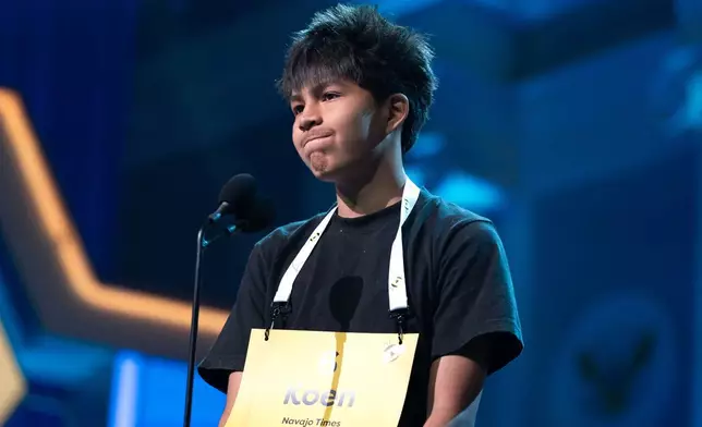Koen Harvey, 14, of Tsaile, Ariz., spells his word during the preliminary round of the Scripps National Spelling Bee at DAR Constitution Hall, Tuesday, May 26, 2026, in Washington. (AP Photo/Jose Luis Magana)