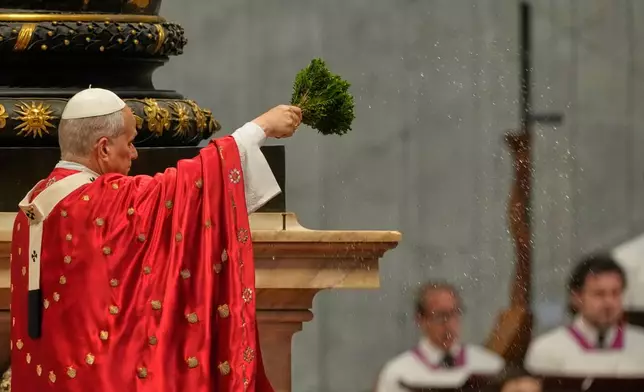 Pope Leo XIV blesses faithful as he celebrates the Pentecost Mass in St. Peter's Basilica, at the Vatican, Sunday, May 24, 2026. (AP Photo/Gregorio Borgia)