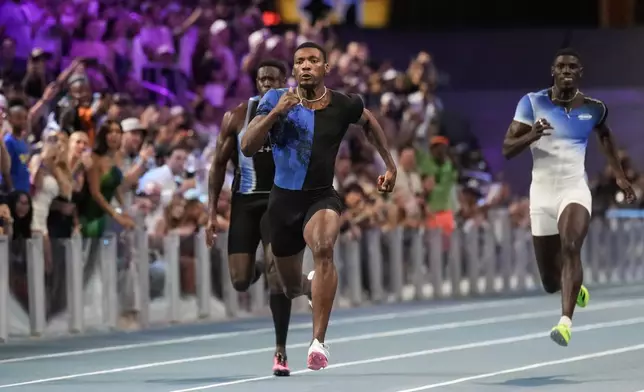 Fred Kerley, of the United States, competes in the men's 100-meter final at the Enhanced Games in Las Vegas, Sunday, May 24, 2026. (AP Photo/Jae C. Hong)