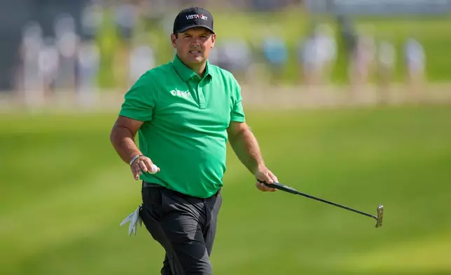 Patrick Reed waves on the 17th green during the third round of the PGA Championship golf tournament at Aronimink Golf Club, Saturday, May 16, 2026, in Newtown Square, PA. (AP Photo/Frank Franklin II)