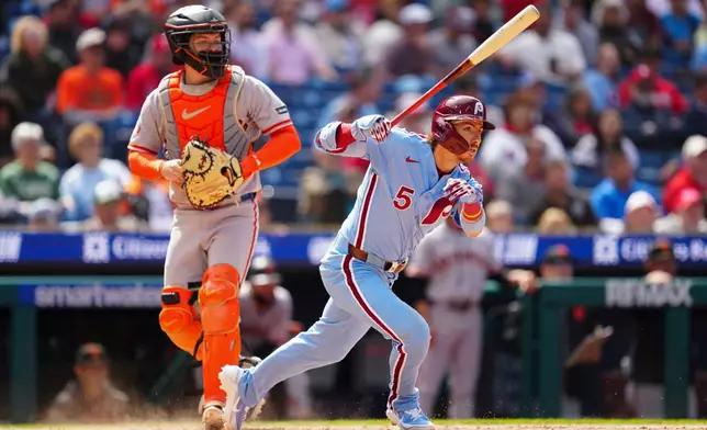 Philadelphia Phillies' Bryson Stott hits an RBI triple off San Francisco Giants pitcher Ryan Walker during the ninth inning of the first baseball game of a doubleheader, Thursday, April 30, 2026, in Philadelphia. (AP Photo/Derik Hamilton)
