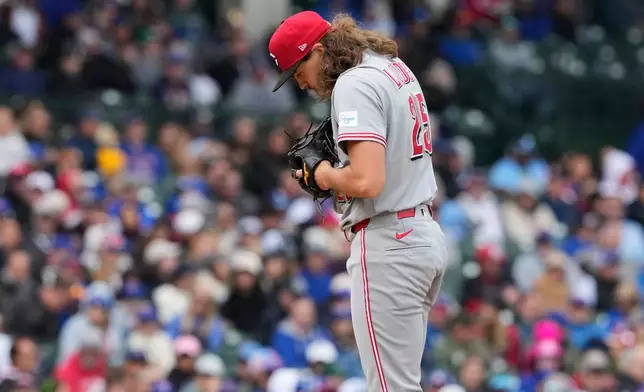Cincinnati Reds starting pitcher Rhett Lowder reacts during the second inning of a baseball game against the Chicago Cubs in Chicago, Thursday, May 7, 2026. (AP Photo/Nam Y. Huh)