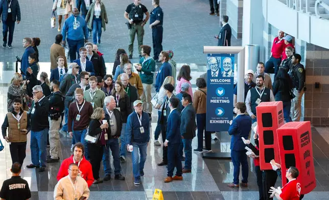 Shareholders arrive inside the CHI Health Center Omaha for the Berkshire Hathaway annual meeting on Saturday, May 2, 2026, in Omaha, Neb. (AP Photo/Rebecca S. Gratz)