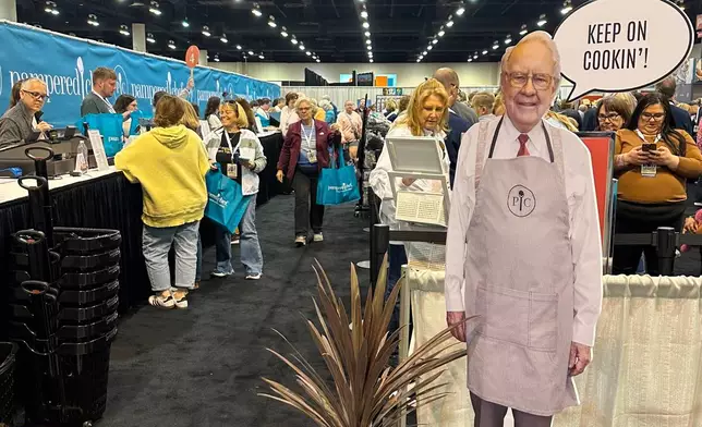 Berkshire Hathaway shareholders line up to buy products at the Pampered Chef booth behind a cutout of longtime CEO Warren Buffett who stepped down in January on Friday, May 1, 2026 in Omaha, Neb. (AP Photo/Josh Funk)