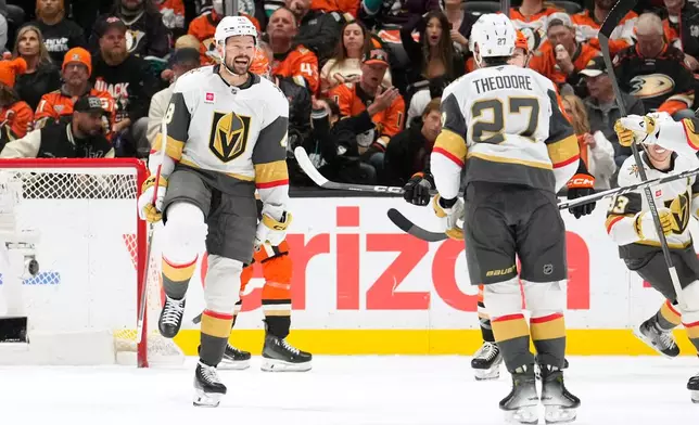 Vegas Golden Knights defenseman Shea Theodore, right, celebrates his goal with center Tomas Hertl, left, during the first period in Game 6 of a second-round NHL hockey Stanley Cup playoff series against the Anaheim Ducks, Thursday, May 14, 2026, in Anaheim, Calif. (AP Photo/Mark J. Terrill)