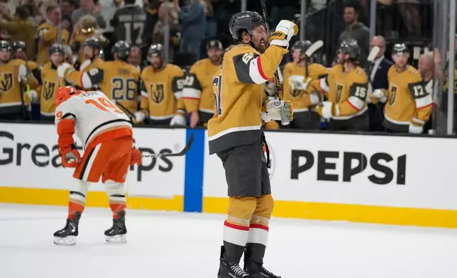 Vegas Golden Knights right wing Mark Stone (61) celebrates after a goal by Vegas Golden Knights right wing Mitch Marner during the third period of Game 1 of a second-round NHL hockey Stanley Cup playoff series Monday, May 4, 2026, in Las Vegas. (AP Photo/John Locher)