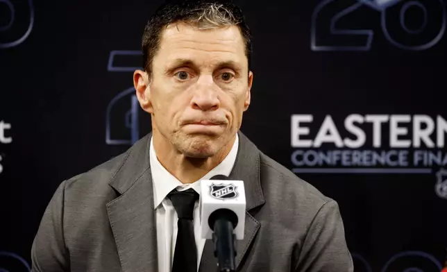 Carolina Hurricanes head coach Rod Brind'Amour speaks to the media following Game 1 of the Eastern Conference finals NHL hockey Stanley Cup playoffs series between the Carolina Hurricanes and the Montréal Canadiens in Raleigh, N.C., Thursday, May 21, 2026. (AP Photo/Karl DeBlaker)
