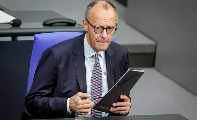 Federal Chancellor Friedrich Merz (CDU) attends a Bundestag session in Berlin, on Thursday, May 21, 2026. (Kay Nietfeld/dpa via AP)