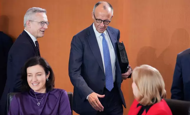 German Chancellor Friedrich Merz, center, attends the cabinet meeting at the chancellery in Berlin, Germany, Wednesday, May 20, 2026. (AP Photo/Ebrahim Noroozi)