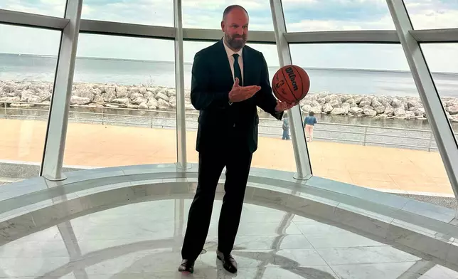 Milwaukee Bucks' new head coach Taylor Jenkins poses after an NBA basketball news conference, Wednesday, May 6, 2026, at the Milwaukee Art Museum in Milwaukee. (AP Photo/Steve Megargee)