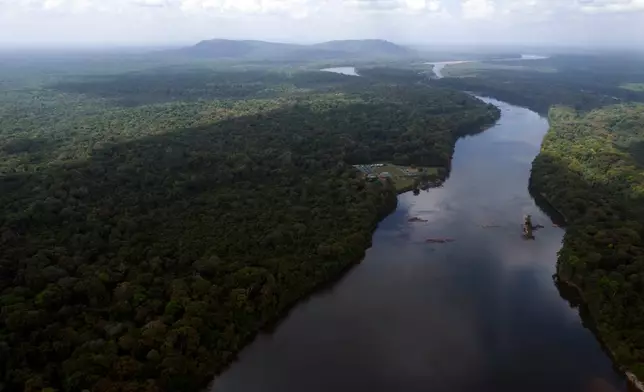 FILE - The Essequibo River flows through Kurupukari crossing in Guyana, Nov. 19, 2023. (AP Photo/Juan Pablo Arraez, File)