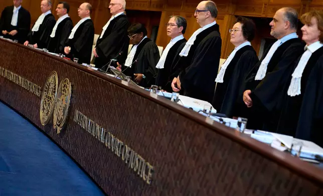Presiding Judge Yuji Iwasawa, fifth right, opens the court session of the International Court of Justice for a week of hearings in a border dispute dating back to the end of the 19th century between Guyana and Venezuela, in The Hague, Netherlands, Monday, May 4, 2026. (AP Photo/Peter Dejong)