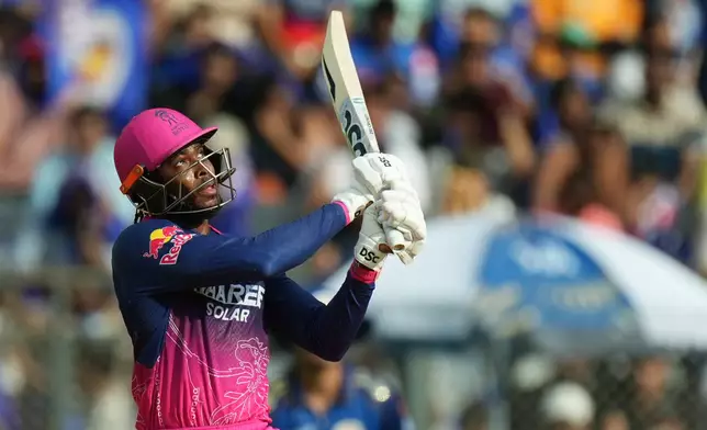 Rajasthan Royals' Jofra Archer hits a six during the Indian Premier League cricket match between Mumbai Indians and Rajasthan Royals in Mumbai, India, Sunday, May 24, 2026. (AP Photo/Ajit Solanki)