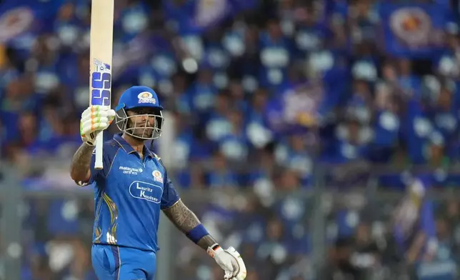 Mumbai Indians' Suryakumar Yadav celebrates his fifty runs during the Indian Premier League cricket match between Mumbai Indians and Rajasthan Royals in Mumbai, India, Sunday, May 24, 2026. (AP Photo/Ajit Solanki)