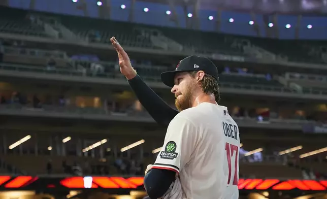 Minnesota Twins starting pitcher Bailey Ober (17) acknowledges the crowd after pitching a complete-game shutout of a baseball game against the Miami Marlins Tuesday, May 12, 2026, in Minneapolis. (AP Photo/Abbie Parr)