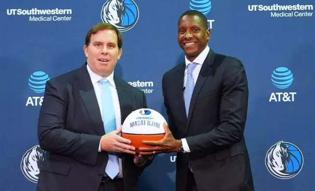 Dallas Mavericks's new team president Masai Ujiri, right, and team governor Patrick Dumont pose for a photo during an introductory NBA basketball news conference in Dallas, Tuesday, May 5, 2026. (AP Photo/LM Otero)