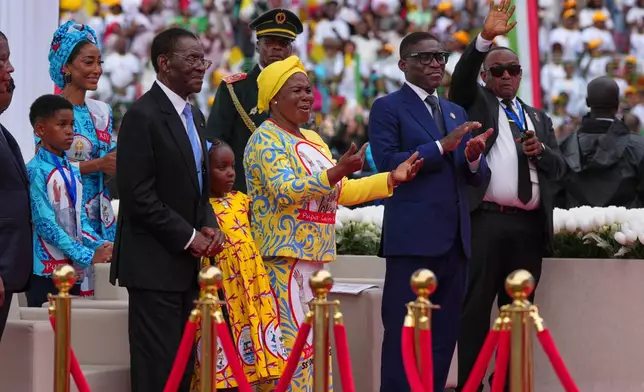 Front row, from left, Equatorial Guinea President Teodoro Obiang Nguema Mbasogo, first lady Constancia Mangue Nsue Okomo, and Equatorial Guinea Vice President Teodoro Nguema Obiang attend a Holy Mass with Pope Leo XIV at the Malabo Stadium in Malabo, Equatorial Guinea, Thursday, April 23, 2026. (AP Photo/Misper Apawu)