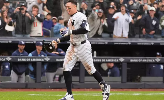 New York Yankees' Aaron Judge reacts after hitting a two-run walk-off home run during the ninth inning of a baseball game against the Tampa Bay Rays, Sunday, May 24, 2026, in New York. (AP Photo/Seth Wenig)