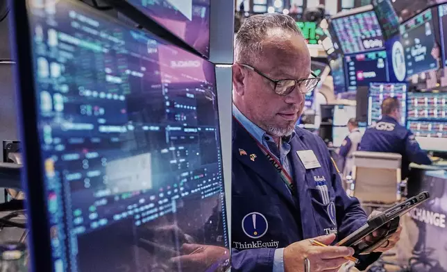 Trader Robert Arciero works on the floor of the New York Stock Exchange, Friday, May 22, 2026. (AP Photo/Richard Drew)