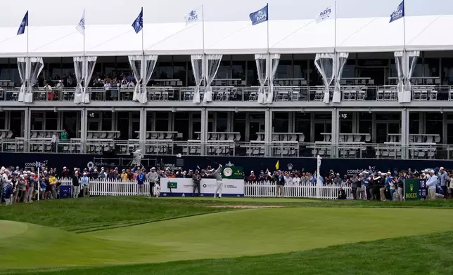 Scottie Scheffler hits on the 18th hole during practice before the PGA Championship golf tournament at the Aronimink Golf Club Monday, May 11, 2026, in Newtown Square, Pa. (AP Photo/Matt Slocum)