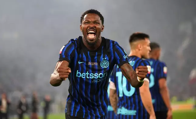Inter Milan's Marcus Thuram celebrates after Lazio's Adam Marusic scored an own goal during the Italian Cup soccer final between Lazio and Inter Milan, in Rome, Wednesday, May 13, 2026. (AP Photo/Andrew Medichini)