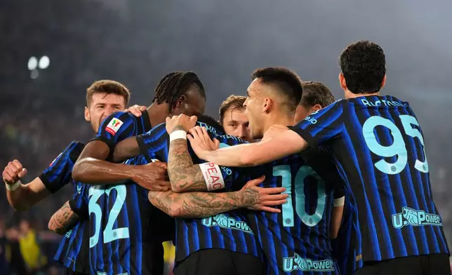 Inter Milan players celebrate after Lazio's Adam Marusic scored an own goal during the Italian Cup soccer final between Lazio and Inter Milan, in Rome, Wednesday, May 13, 2026. (AP Photo/Andrew Medichini)