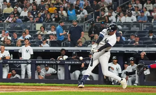 New York Yankees' Ryan McMahon hits a single during the seventh inning of a baseball game against the Texas Rangers Tuesday, May 5, 2026, in New York. (AP Photo/Frank Franklin II)