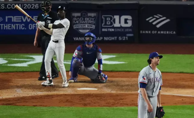 Texas Rangers pitcher Jacob Degrom, right, reacts as New York Yankees' Jazz Chisholm Jr. follows through on a home run during the sixth inning of a baseball game Tuesday, May 5, 2026, in New York. (AP Photo/Frank Franklin II)