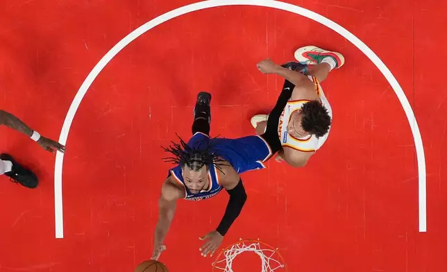 New York Knicks guard Jalen Brunson (11) shoots during the first half of Game 6 in a first-round NBA basketball playoffs series Thursday, April 30, 2026, in Atlanta. (AP Photo/Brynn Anderson)
