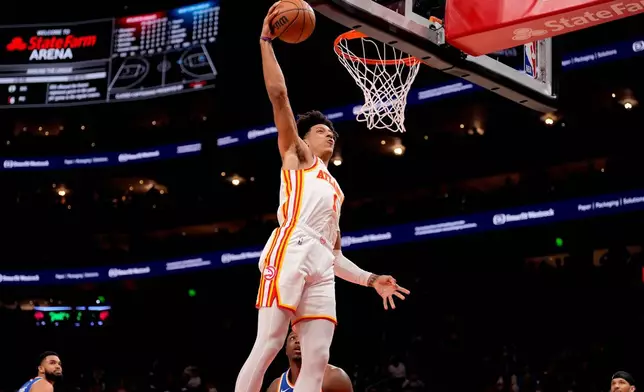 Atlanta Hawks' Jalen Johnson scored during the first half of Game 6 in a first-round NBA playoff basketball game Thursday, Apr. 30, 2026, in Atlanta. (AP Photo/Brynn Anderson)