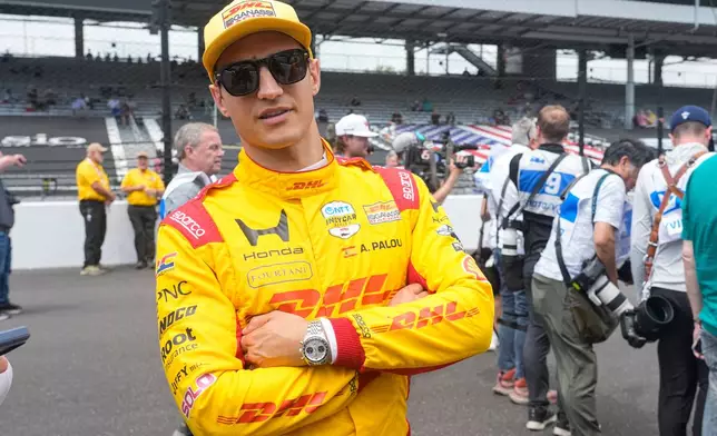 Alex Palou, of Spain, pauses during a photo session before practice for the Indianapolis 500 auto race at the Indianapolis Motor Speedway in Indianapolis, Monday, May 18, 2026. (AP Photo/Michael Conroy)