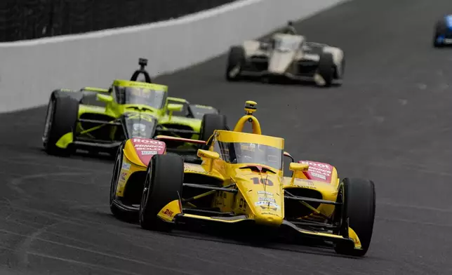Alex Palou, of Spain, heads into the first turn during practice for the Indianapolis 500 auto race at the Indianapolis Motor Speedway in Indianapolis, Monday, May 18, 2026. (AP Photo/Michael Conroy)