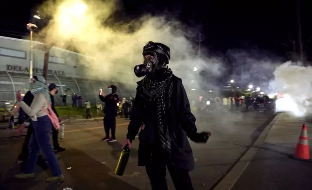 Anti-ICE protesters take to the streets during clashes with law enforcement outside the Delaney Hall detention center on Saturday, May 30, 2026, in Newark, N.J. (AP Photo/Angelina Katsanis)