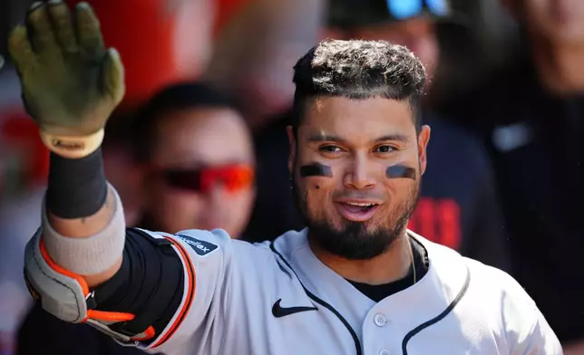 San Francisco Giants' Luis Arraez is greeted in the dugout after his home run in the third inning of a baseball game against the Athletics, Sunday, May 17, 2026, in West Sacramento, Calif. (AP Photo/Alan Greth)