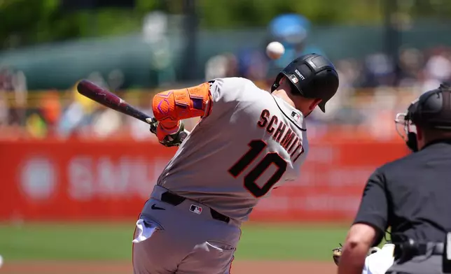 San Francisco Giants designated hitter Casey Schmitt (10) singles during a baseball game against the Athletics, Sunday, May 17, 2026, in West Sacramento, Calif. (AP Photo/Alan Greth)