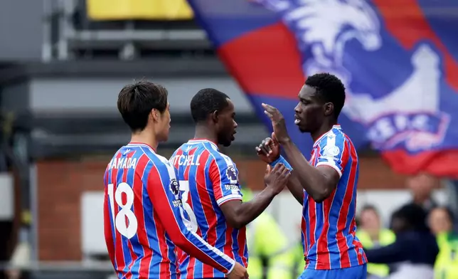 Crystal Palace's Ismaila Sarr, right, celebrates scoring during the English Premier League soccer match between Crystal Palace and Everton in London, Sunday May 10, 2026. (Steven Paston/PA via AP)