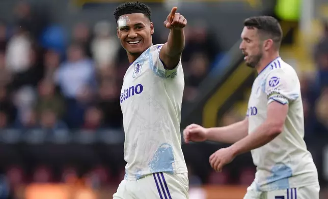 Aston Villa's Ollie Watkins celebrates scoring during the English Premier League soccer match between Burnley and Aston Villa in Burnley, England, Sunday May 10, 2026. (Martin Rickett/PA via AP)