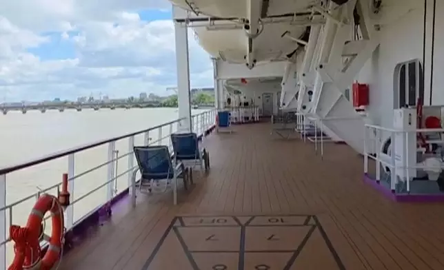 A view of an empty deck of the British cruise ship the Ambition after 1,700 passengers and crew were ordered to remain on board after an outbreak of gastrointestinal illness, in the port of Bordeaux, France, Wednesday, May 13, 2026. (Kevin Starrs via AP)