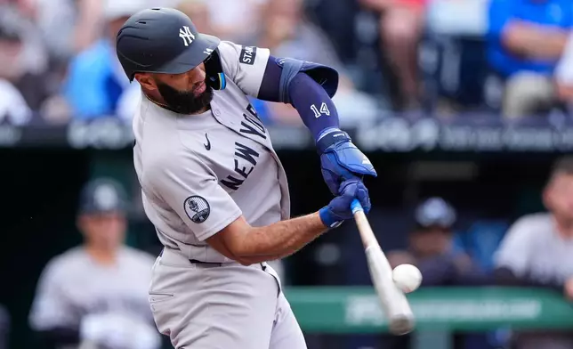 New York Yankees' Amed Rosario hits a two-run home run during the first inning of baseball game against the Kansas City Royals, Tuesday, May 26, 2026, in Kansas City, Mo. (AP Photo/Charlie Riedel)