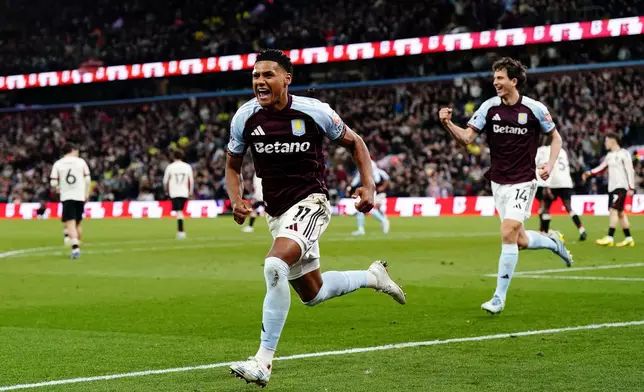 Aston Villa's Ollie Watkins celebrates scoring their side's third goal during the English Premier League soccer match between Aston Villa and Liverpool in Birmingham, England, Friday, May 15, 2026. (Jacob King/PA via AP)