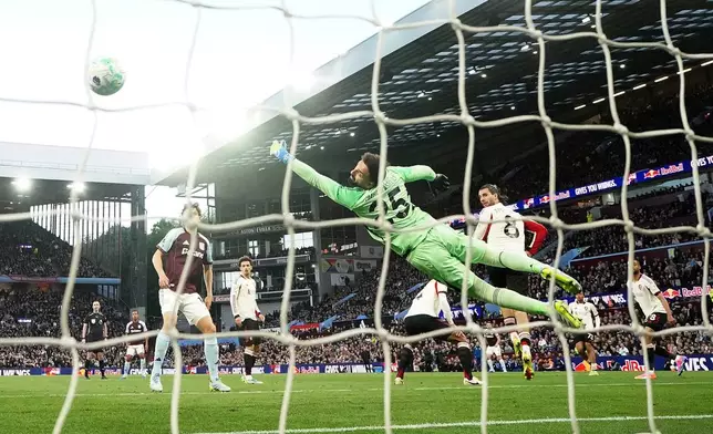 Liverpool goalkeeper Giorgi Mamardashvili fails to prevent Aston Villa's Morgan Rogers, not shown, from scoring during the English Premier League soccer match between Aston Villa and Liverpool in Birmingham, England, Friday, May 15, 2026. (David Davies/PA via AP)