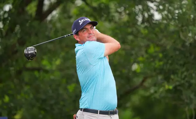 Keegan Bradley watches his tee shot on the ninth hole during the first round of the Charles Schwab Challenge golf tournament at Colonial Country Club in Fort Worth, Texas, Thursday, May 28, 2026. (AP Photo/LM Otero)