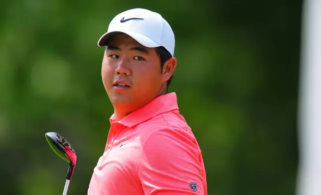 Tom Kim, of South Korea, walks after a tee shot on the sixth hole during the first round of the Charles Schwab Challenge golf tournament at Colonial Country Club in Fort Worth, Texas, Thursday, May 28, 2026. (AP Photo/LM Otero)