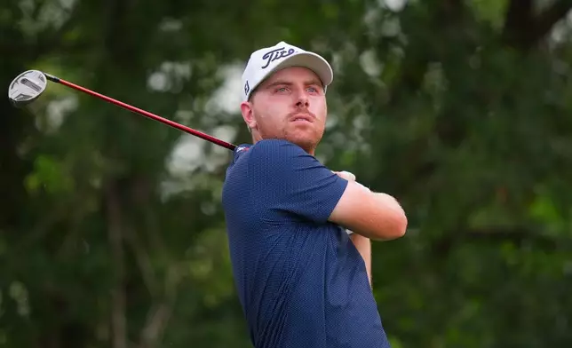 Ryan Gerard watches his tee shot on the ninth hole during the first round of the Charles Schwab Challenge golf tournament at Colonial Country Club in Fort Worth, Texas, Thursday, May 28, 2026. (AP Photo/LM Otero)